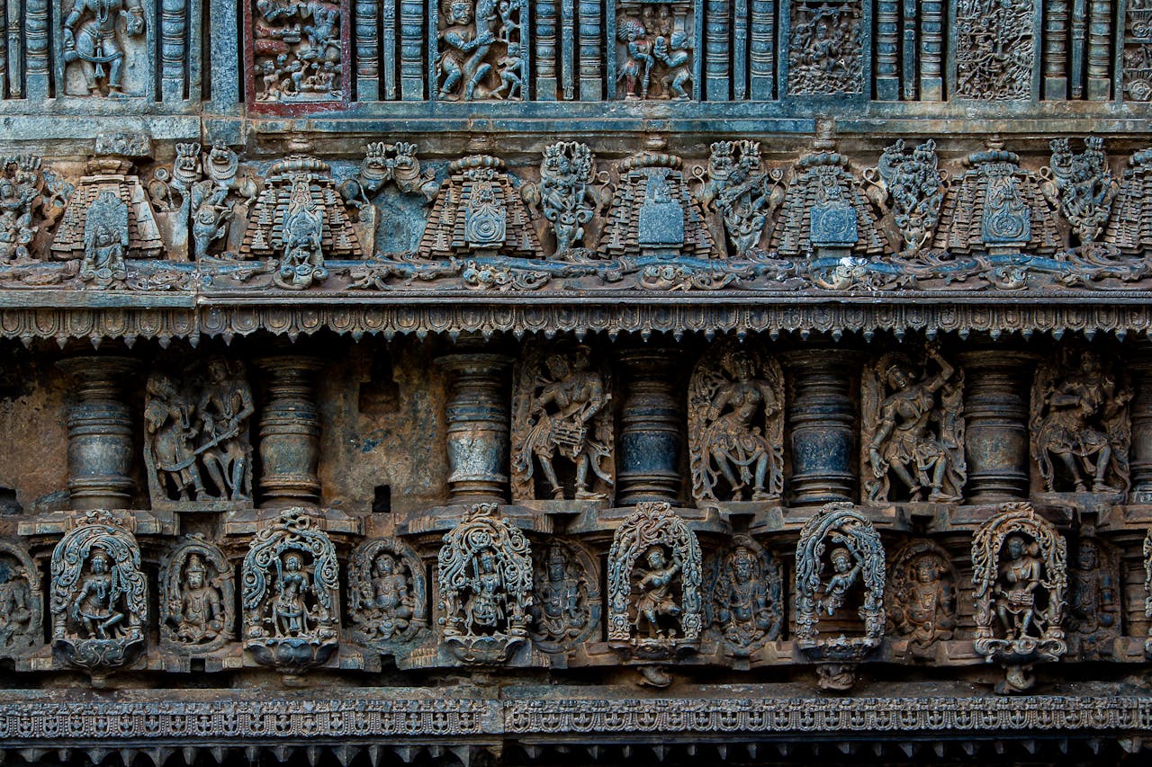 About Detailed stone carvings depicting ancient mythology on an Indian temple facade.