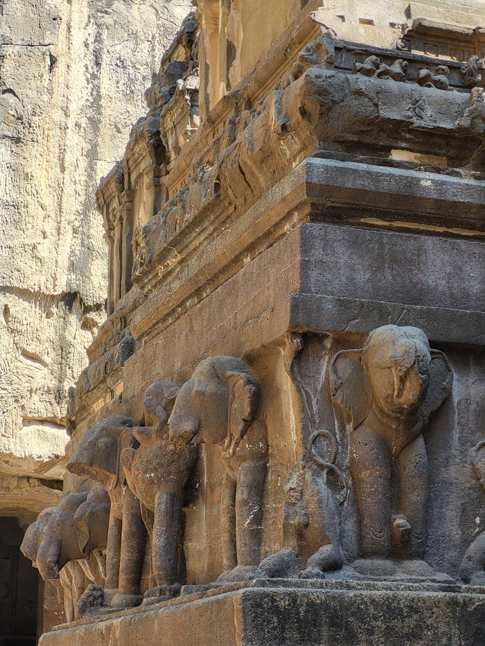 About Detailed stone carvings of elephants at an ancient temple showcasing historical architecture.